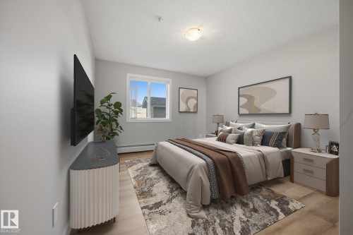 Recessed window with white trim, light wood-finish flooring, ceiling-mounted light fixture, and light gray wall paint - #122 240 Spruce Ridge Rd, Spruce Grove, AB 