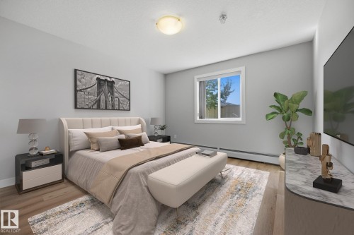 Light wood-finish flooring, white walls, and a single window with a white frame - #122 240 Spruce Ridge Rd, Spruce Grove, AB 