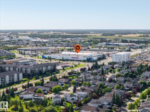 Established suburban neighborhood with diverse residential structures, abundant green spaces, and commercial amenities - #122 240 Spruce Ridge Rd, Spruce Grove, AB 