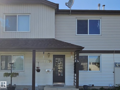 Light-colored horizontal siding and vertical siding accents - 14674 54 Street Northwest, Edmonton, AB 