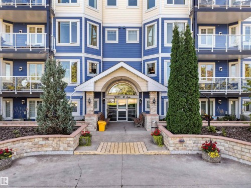 Multi-story exterior with blue siding and cream accents - #206 12111 51 Av Nw, Edmonton, AB 