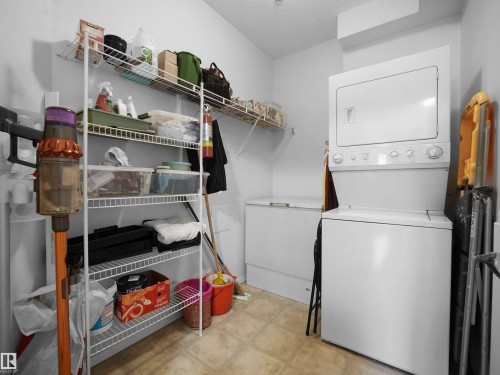 Stackable white washer and dryer unit, chest freezer, and wire shelving system - #206 12111 51 Av Nw, Edmonton, AB 