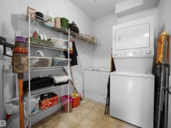 Stackable white washer and dryer unit, chest freezer, and wire shelving system - 