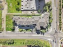 Extensive multi-unit residential property with complex rooflines, surrounded by paved roadways and mature landscaping - #206 12111 51 Av Nw, Edmonton, AB 