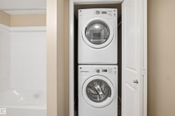 Built-in stacked washer and dryer appliances within a dedicated closet - 