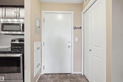 Stainless steel microwave, stainless steel range, and wood-finish cabinetry - 
