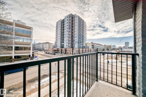 Exterior balcony featuring a concrete floor and black metal railings - #302 10606 123 St Nw, Edmonton, AB 