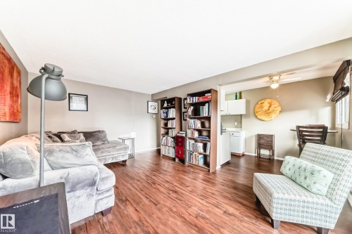 Wood-finish flooring throughout, with a neutral wall palette - #302 10606 123 St Nw, Edmonton, AB 
