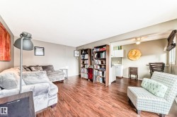 Wood-finish flooring throughout, with a neutral wall palette - 