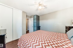 Wood-finish flooring with a neutral wall color and white trim - 