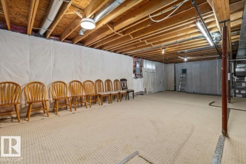 Exposed wood ceiling joists and support beams, with a finished floor surface - #92 13320 124 St Nw, Edmonton, AB 
