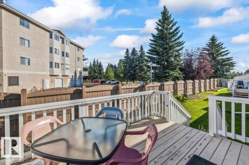 Wood-finish deck with white railings and steps - #92 13320 124 St Nw, Edmonton, AB 