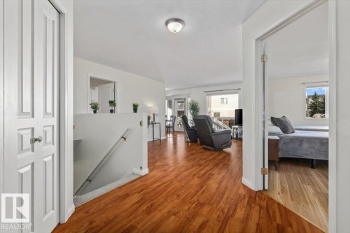 Wood-finish flooring throughout the main level - #92 13320 124 St Nw, Edmonton, AB 