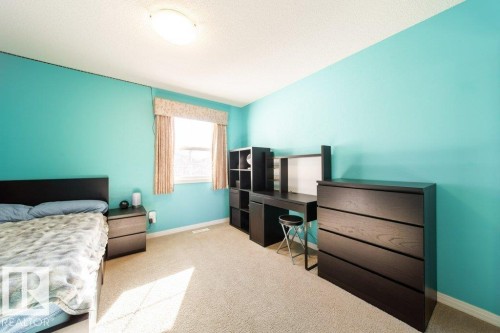 Carpeted flooring, window with curtains, and flush-mount ceiling lighting - 16120 138 Street Nw, Edmonton, AB 