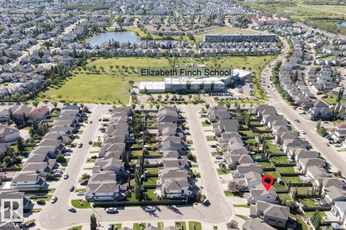 Residential neighborhood featuring a mix of detached homes, Elizabeth Finch School, and a nearby pond - 16120 138 Street Nw, Edmonton, AB 