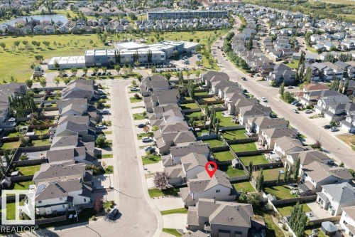 Residential street with detached homes, private fenced yards, and paved roads - 16120 138 Street Nw, Edmonton, AB 