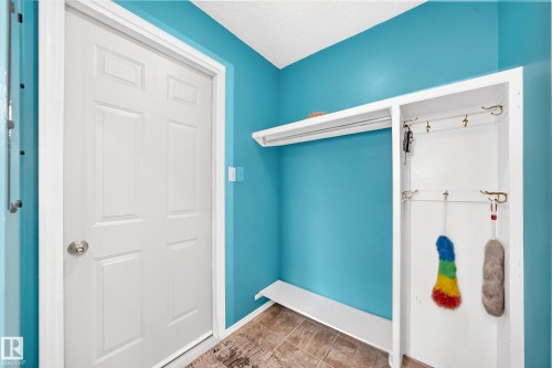 Built-in storage solutions, integrated coat hooks, and durable tiled flooring - 8224 186 Street Nw, Edmonton, AB 