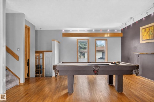 Hardwood flooring, track lighting, recessed ceiling lights, wood-finish trim, multiple windows - 17103 92 Street Nw, Edmonton, AB 