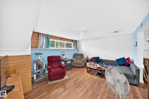 Wood-finish flooring with horizontal wood paneling - 11007 37 Avenue Nw, Edmonton, AB 