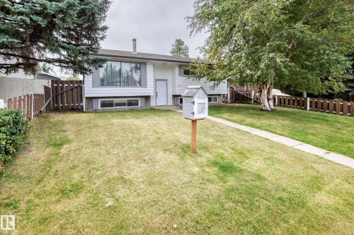 White exterior with grey shutters and a white entry door - 11007 37 Avenue Nw, Edmonton, AB 