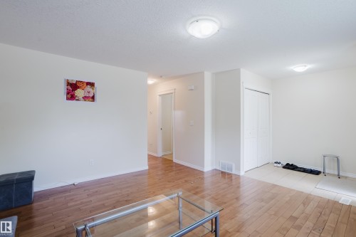 Wood-finish flooring throughout the main area - 10332 161 Street Nw, Edmonton, AB 