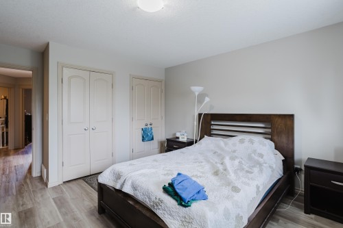 Light wood-finish flooring, recessed ceiling light, and neutral wall tones - 10334 161 Street Nw, Edmonton, AB 