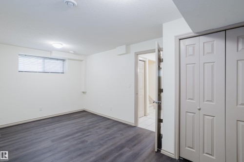 Wood-finish flooring, recessed lighting, and a flush-mount light fixture - 10334 161 Street Nw, Edmonton, AB 