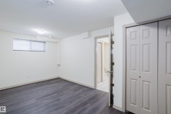 Wood-finish flooring, recessed lighting, and a flush-mount light fixture - 