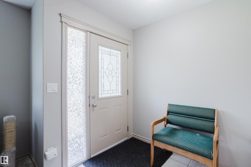 Entry door with leaded glass insert and frosted glass sidelight - 10334 161 Street Nw, Edmonton, AB 