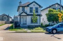 Two-story residential structure featuring white siding and dark green trim - 203 84 Street Sw, Edmonton, AB  - Outdoor With Facade 