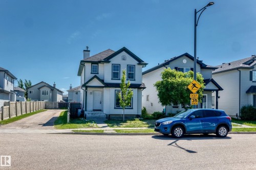 Two-story home with white siding and dark trim detailing - 203 84 Street Sw, Edmonton, AB - Outdoor With Facade