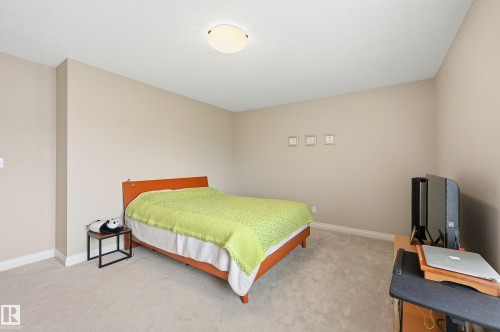 Neutral-toned walls complement the light-colored carpeting - 1111 176 Street Sw, Edmonton, AB 