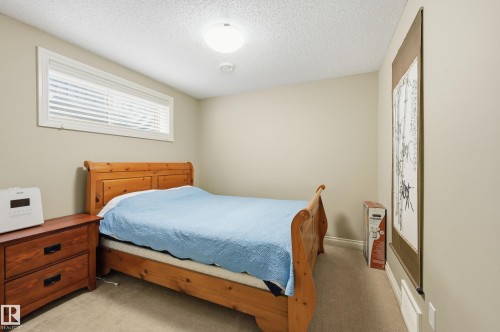 Carpeted flooring, neutral wall paint, and overhead flush-mount lighting - 1111 176 Street Sw, Edmonton, AB 