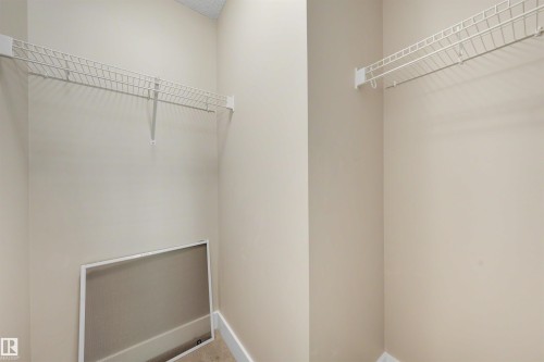 Neutral wall tones with white wire shelving - 2125 24 Street Nw, Edmonton, AB 