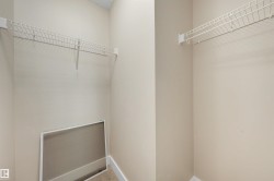 Neutral wall tones with white wire shelving - 