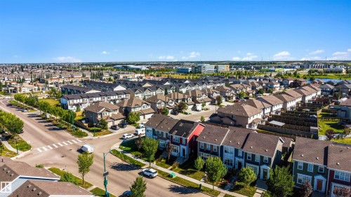 Residential neighborhood featuring a mix of detached and attached homes with varied exterior finishes - 2125 24 Street Nw, Edmonton, AB 
