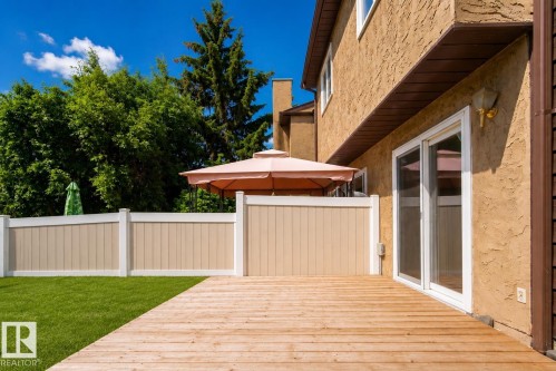 Wood-finish deck with a stucco exterior - 3173 139 Avenue Nw, Edmonton, AB 