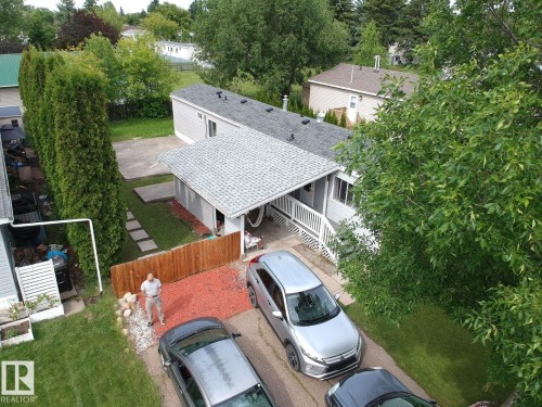 Single-story residence featuring light gray siding and a shingled roof - 8 The Parkway Northwest, Edmonton, AB - Outdoor
