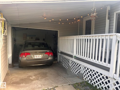Covered carport with concrete flooring - 8 The Parkway Northwest, Edmonton, AB 