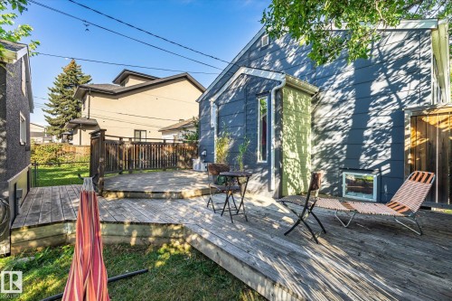 Expansive multi-level wood deck, wood privacy fence, and manicured lawn - 10943 72 Avenue Nw, Edmonton, AB 