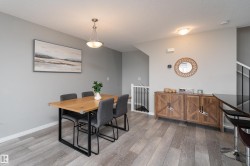 Wood-finish flooring throughout, with a built-in wood-look side cabinet - 