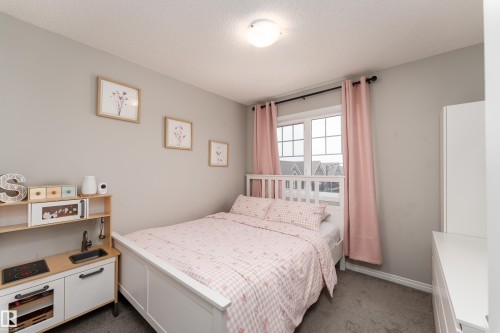 Wall-to-wall carpeting and neutral wall paint - 20247 16 Avenue Nw, Edmonton, AB 