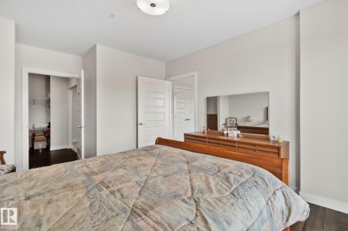 High ceilings, dark wood-finish flooring, and white interior doors - #404 2755 109 St Nw, Edmonton, AB 