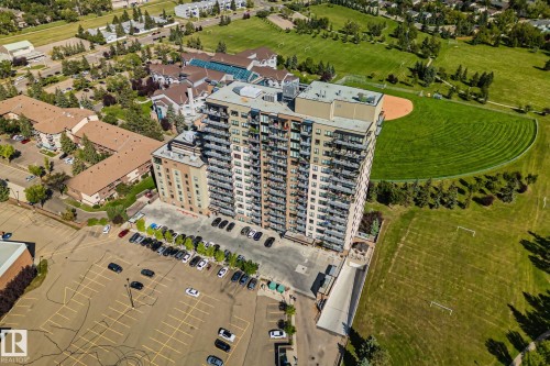 High-rise residential building featuring multiple balconies and dedicated surface parking - #404 2755 109 St Nw, Edmonton, AB 