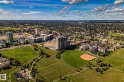 Expansive green spaces with a baseball diamond and multiple sports fields - 