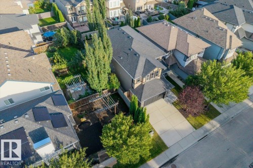 Paved driveway leading to an attached garage - 1090 Armitage Crescent Sw, Edmonton, AB 