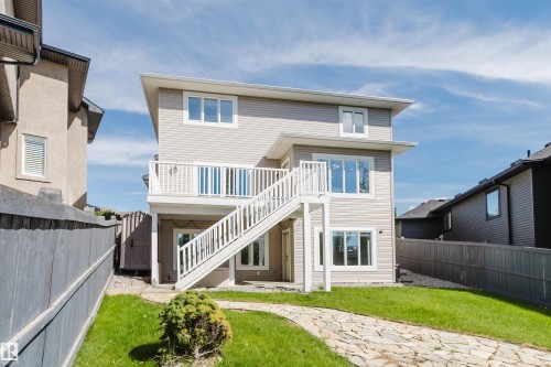 Two-story exterior with light-colored siding - 3412 Macneil Link Nw, Edmonton, AB 