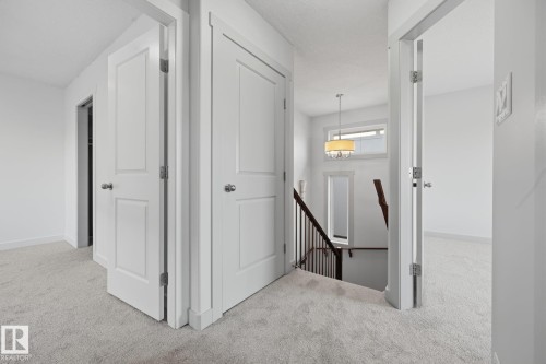 Light-toned wall-to-wall carpeting throughout - 8952 81 Avenue Nw, Edmonton, AB 