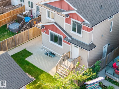 Aerial View of the exterior back of the home that boasts a very well manicured yard and large patio. - 8952 81 Avenue Nw, Edmonton, AB 