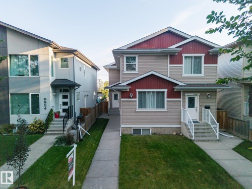 Two-story properties with distinct architectural styles, featuring well-maintained lawns and concrete walkways - 8952 81 Avenue Nw, Edmonton, AB 
